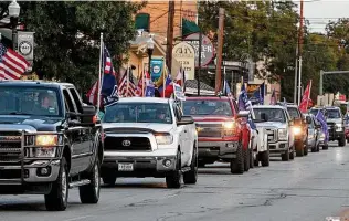  ?? Tomreel / Staff photograph­er ?? The Trump Train begins at a parking lot in Gruene and travels to downtown New Braunfels.