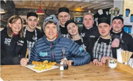  ??  ?? Radio 1 DJ, Greg James, alongside staff at The Real Food Cafe in Tyndrum.