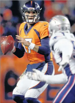  ?? ASSOCIATED PRESS PHOTO/DAVID ZALUBOWSKI ?? Denver Broncos quarterbac­k Brock Osweiler (17) looks to throw as New England Patriots outside linebacker Elandon Roberts (52) pursues during their NFL game against the New England Patriots on Sunday in Denver.