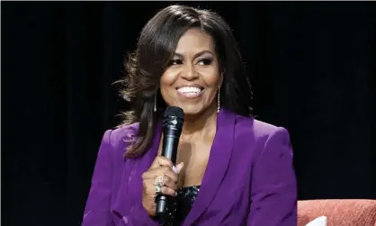  ?? Photograph: Paul R Giunta/ Invision/AP ?? Michelle Obama during Becoming: An Intimate Conversati­on with Michelle Obama, in Atlanta in May 2019.