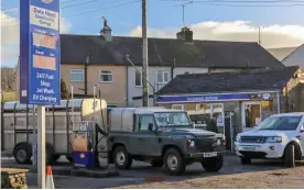  ??  ?? Well worth the journey: A motorist fills up at Dale Head Garage