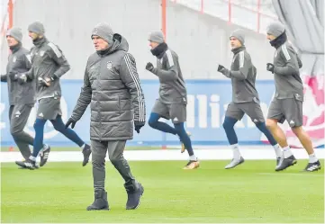  ??  ?? Bayern Munich’s German head coach Jupp Heynckes (front) overseas the training session of FC Bayern Munich prior the UEFA Champions League Group B match between FC Bayern Munich vs PSG Paris at the training Center in Munich. — AFP photo