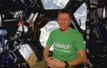  ??  ?? Tim Peake on the Internatio­nal Space Station wearing one of thet-shirts he packed