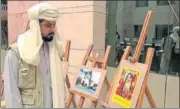  ?? RAJEEV MULLICK/HT ?? Baloch leader and freedom fighter Mir Mazdak Dilshad Khan viewing an exhibition showing the pains and sufferings of Baloch people at Dr Shakuntala Misra National University on Sunday.