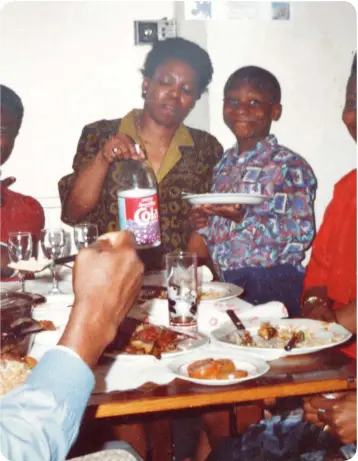  ?? ?? Tucking in: a young Jimi Famurewa at family Christmas dinner in 1992