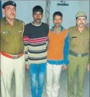  ?? HT PHOTO ?? The two accused in the custody of police personnel in Panipat on Monday.