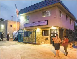  ?? Robert Gourley Los Angeles Times ?? COMPTON residents stand outside a meeting of the Sativa Los Angeles County Water District board in June. The agency has been accused of serving dirty water.