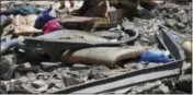  ?? HAZEM AHMED ?? Debris covers the ground after an airstrike at a detention center in Tajoura, east of Tripoli in Libya, Wednesday, July 3, 2019. An airstrike hit the detention center for migrants early Wednesday, killing several.