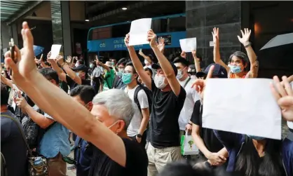  ?? Photograph: Tyrone Siu/Reuters ?? Protests in Hong Kong against the new national security law. Australia’s Telstra says it isn’t planning to leave the territory as is ‘really just following Dfat’s advice’.