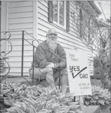  ?? NATHAN ROCHFORD/CP ?? Leo Cheverie poses for a portrait with his sign from the 2005 referendum in Charlottet­own on Tuesday.