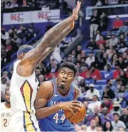  ??  ?? Oklahoma City Thunder center Dakari Johnson looks for room to shoot against New Orleans Pelicans center DeMarcus Cousins.