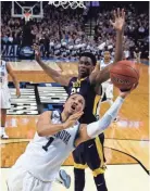  ?? ASSOCIATED PRESS ?? Villanova’s Jalen Brunson drives past West Virginia’s Wesley Harris.