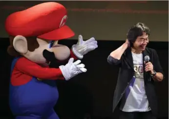  ?? TOSHIFUMI KITAMURA/AFP/GETTY IMAGES ?? Shigeru Miyamoto, creator of Super Mario Bros., marks the game’s 30th anniversar­y last month in Tokyo. Miyamoto is to video games what Shakespear­e was to drama or Dickens to the novel, writes John Higgs.