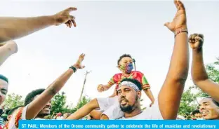  ?? — AFP ?? ST PAUL: Members of the Oromo community gather to celebrate the life of musician and revolution­ary Hachalu Hundessa at the Oromo Community Center in St Paul, Minnesota.