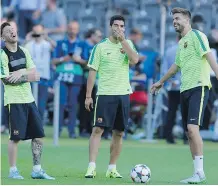  ?? THE ASSOCIATE PRESS ?? Barcelona’s Lionel Messi, left, Luis Suarez and Gerard Pique share a laugh during practice at Olympic stadium in Berlin a day before the Champions League final between Juventus and FC Barcelona.