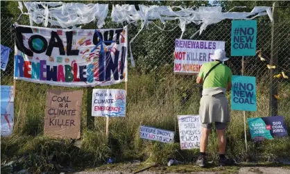  ??  ?? A protester outside the proposed site of Woodhouse Colliery, south of Whitehaven in Cumbria. Photograph: Owen Humphreys/PA