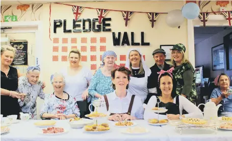  ??  ?? Staff and residents Barnes Court care home take a step back in time with a 1940s-style street party in aid of Help for Heroes.