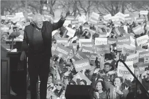  ?? AP Photo/Charles Rex Arbogast ?? Democratic presidenti­al candidate Sen. Bernie Sanders, I-Vt., waves to supporters after speaking at a campaign rally Saturday in Chicago’s Grant Park.