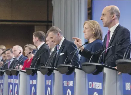  ?? JACQUES BOISSINOT/ THE CANADIAN PRESS ?? Steven Blaney, right, speaks during the Conservati­ve Party French language debate Tuesday in Quebec City.