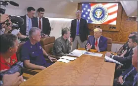  ?? AP/EVAN VUCCI ?? President Donald Trump participat­es in a Hurricane Dorian briefing Monday aboard Air Force One at Marine Corps Air Station Cherry Point in Havelock, N.C. Among those joining the president were North Carolina Gov. Roy Cooper (left) and House Minority Leader Kevin McCarthy (standing center).