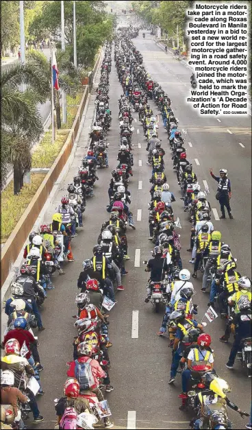  ??  ?? Motorcycle riders take part in a motorcade along Roxas Boulevard in Manila yesterday in a bid to set a new world record for the largest motorcycle gathering in a road safety event. Around 4,000 motorcycle riders joined the motorcade, which was held to...