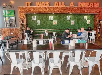  ?? ?? Nicola Blaque, chef and owner of The Jerk Shack, designed the interior to mimic a typical Caribbean jerk shack while putting a modern twist on traditiona­l food.