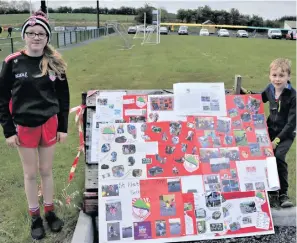  ??  ?? Sadhbh and Ódhran Flanagan with the Lillipop Lane creche display for the programme.