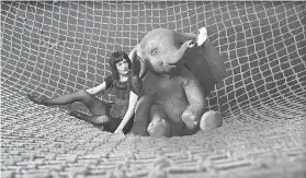  ??  ?? Aerial star Colette Marchant (Eva Green) teams up with a baby elephant who can fly in the new “Dumbo” from director Tim Burton. DISNEY