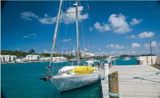  ??  ?? Totem flying the yellow quarantine flag (or Q flag) upon entering Bermuda in 2017. Landing in a new country is a little bit more complicate­d lately.