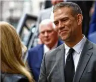 ?? Jeremy C. Fox can be reached at jeremy.fox@globe.com. Follow him @ jeremycfox. ?? A priest led a procession in for the funeral of Larry Lucchino at St. Cecilia. Left, Theo Epstein, former Red Sox executive and current adviser, spoke with another mourner.