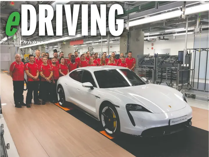  ?? ANDREW MCCREDIE/DRIVING.CA ?? A proud moment for factory workers as a Porsche Taycan rolls off the line at the state-of-the-art Zero Impact Factory in Stuttgart-Zuffenhaus­en.