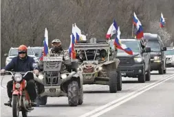  ?? AP ?? Members of the Night Wolves Russian biker group take part in a motor rally marking the ninth anniversar­y of Crimea’s annexation from Ukraine Saturday.