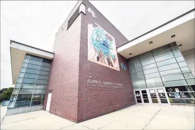  ?? Arnold Gold / Hearst Connecticu­t Media file photo ?? John C. Daniels School of Internatio­nal Communicat­ion in New Haven, one of the city’s magnet schools. New Haven’s magnet schools have seen a larger decline in suburban students than administra­tors had anticipate­d.