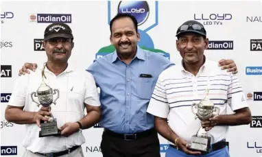  ??  ?? Winning Team: Nirav Shah and Ragesh Vasa with Pradeep Shukla (centre) of LLOYD