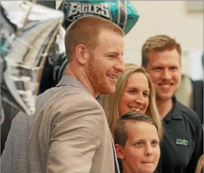  ?? GENE WALSH — DIGITAL FIRST MEDIA ?? Carson Wentz speaks with guests at Revival Outreach Center event.