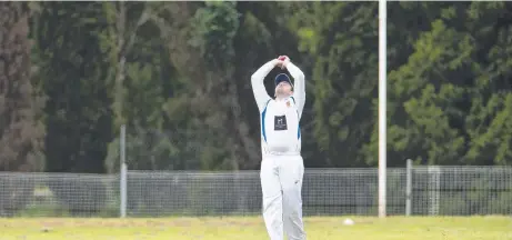  ?? Picture: Kevin Farmer ?? GOT HIM: Pat Bourke takes a catch for University to remove Darren Koch of Metropolit­an-Easts out in round seven TCI A-grade action at USQ Oval.