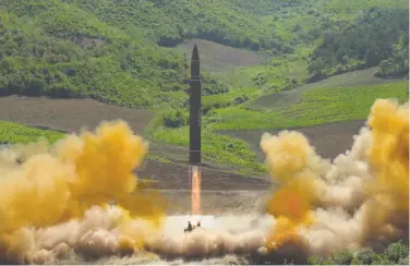  ?? Korean Central News Agency ?? The ballistic missile reached an altitude of 1,500 miles and covered about 580 miles, North Korea says.