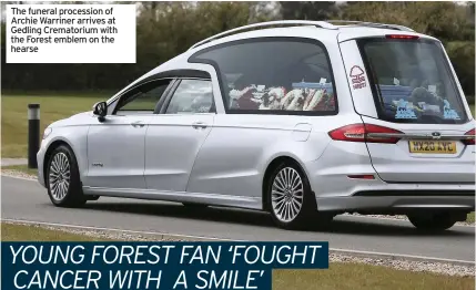  ??  ?? The funeral procession of Archie Warriner arrives at Gedling Crematoriu­m with the Forest emblem on the hearse