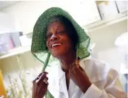  ?? STAFF PHOTO BY DOUG STRICKLAND ?? Atheria Freeman dons a bonnet for her 19th-century costume before a rehearsal for a celebratio­n of Second Missionary Baptist Church’s 150th anniversar­y on Friday. The church celebrates its anniversar­y today.