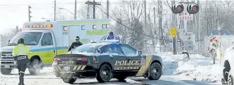  ?? KAREN LONGWELL/METROLAND MEDIA ?? Emergency crews responded to the D'Arcy Street train crossing in Cobourg after a person was hit by a train just before 9 a.m. on Monday.
