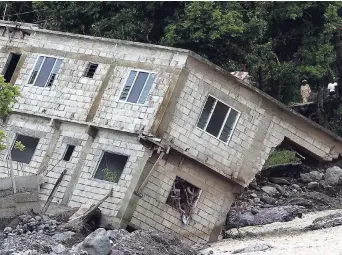  ??  ?? This house in Mt Lebanus in St Thomas was damaged during the passage of Hurricane Ivan in 2004.