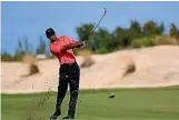  ?? GETTY IMAGES ?? Tiger Woods is back putting his irons to the use for which they were intended.