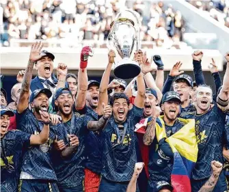  ?? Marcio Jose Sanchez/Associated Press ?? Carlos Vela, hoisting the championsh­ip trophy, and Los Angeles FC are again one of the favorites to win the MLS Cup after returning a loaded roster from last year’s championsh­ip squad.