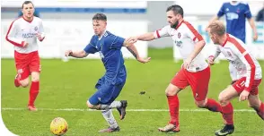  ??  ?? Cove Rangers’ Mitch Megginson takes the ball away from Spartans’ Ian Mcfarland and Scott Maxwell.
