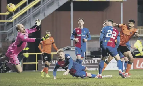  ??  ?? 0 Osman Sow, far right, watches his shot on the turn fly past goalkeeper Mark Ridgers to give Dundee United a two- goal lead.