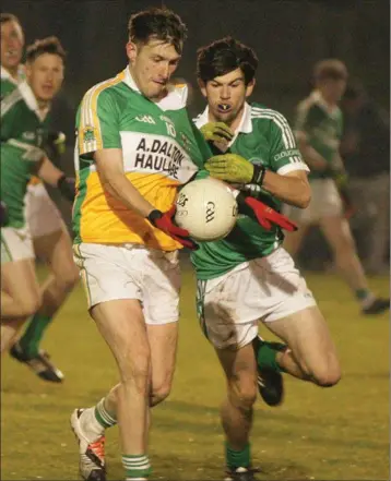  ??  ?? Duffry Rovers captain Stephen Watchorn is tackled by Connal Flood (Cloughbawn) in Friday’s Co. final.