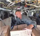  ?? Haiti. ALEX BRANDON/AP ?? U.S. Marine Corps Lance Cpl. Brandon Oldham unloads food from a VM-22 Osprey at Jeremie Airport in Jeremie,