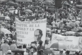  ?? KEN HAWKINS/ ZUMA PRESS ?? An estimated 250,000 people, including pilgrims from around the world, gather as El Salvador celebrates the beatificat­ion ceremony and Mass announcing the beatificat­ion of Archbishop Oscar Romero, on May 23, 2015. The Archbishop was slain at the altar...