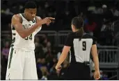  ?? MORRY GASH — THE ASSOCIATED PRESS ?? The Milwaukee Bucks’ Giannis Antetokoun­mpo argues a call with referee Natalie Sago (9) during a preseason game against the Dallas Mavericks on Friday in Milwaukee.