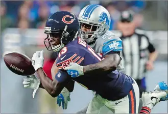  ?? REY DEL RIO/AP PHOTO ?? Lions cornerback Nevin Lawson (24) deflects a pass intended for Bears wide receiver Kendall Wright (13) during the second half of Saturday’s game at Detroit. The Lions won 20-10.